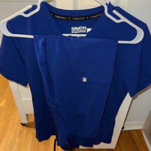 Fabletics Galaxy Blue scrub set brand new only worn once 
Top and bottom xs